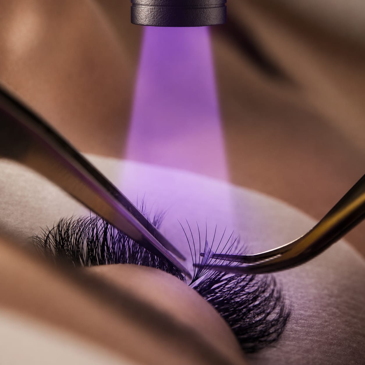 UV light-cured lash extensions during application at Sonthuy Beauty, Tucson
